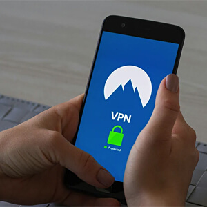 woman looking at phone logging in to VPN