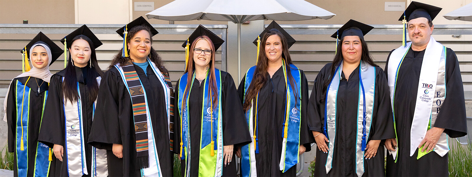 Graduates displaying various academic regalia