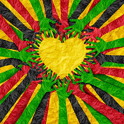 papercut outs of hands forming a heart in Black History Month colors