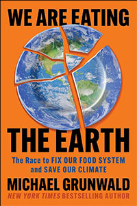 Book cover for "We Are Eating the Earth" by Michael Grunwald, featuring a cracked globe plate on an orange background.